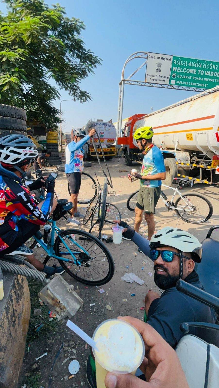 Waiting out two punctures at the tyre stall by Halol Chokdi