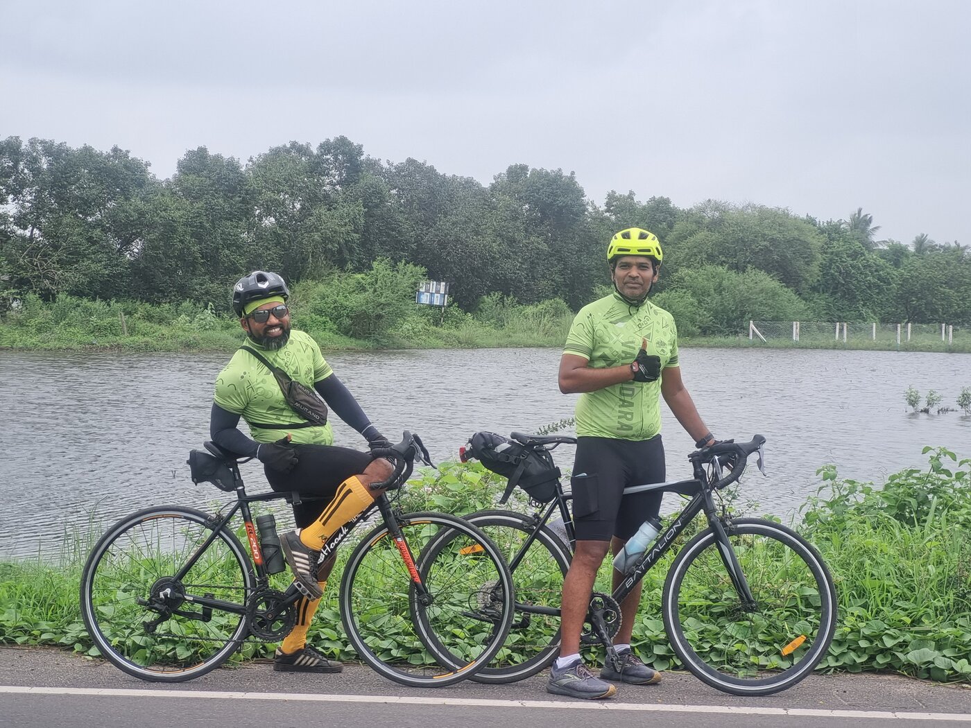 Vadodara cyclists wearing the Sloww Cheetah heritage jersey, stopped by a lake